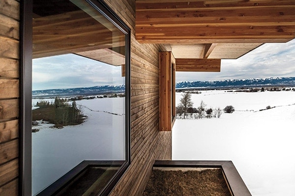 Exterior photo of windows on a cabin in winter