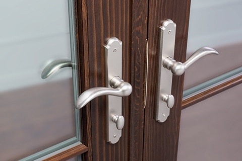 Multipoint lock hardware on wood French patio doors