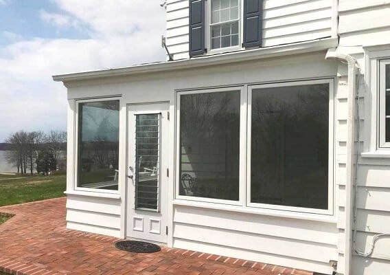 new large casement windows in sunroom replacement project