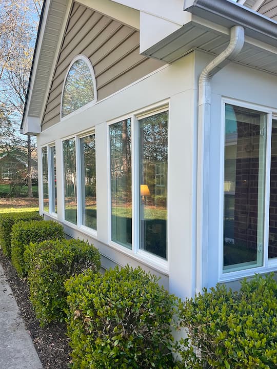 Exterior corner view of Yorktown home with new Pella vinyl windows