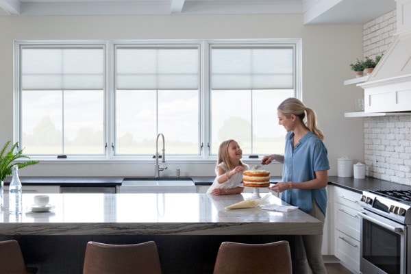 beautiful white kitchen with stunning natural light from pella windows
