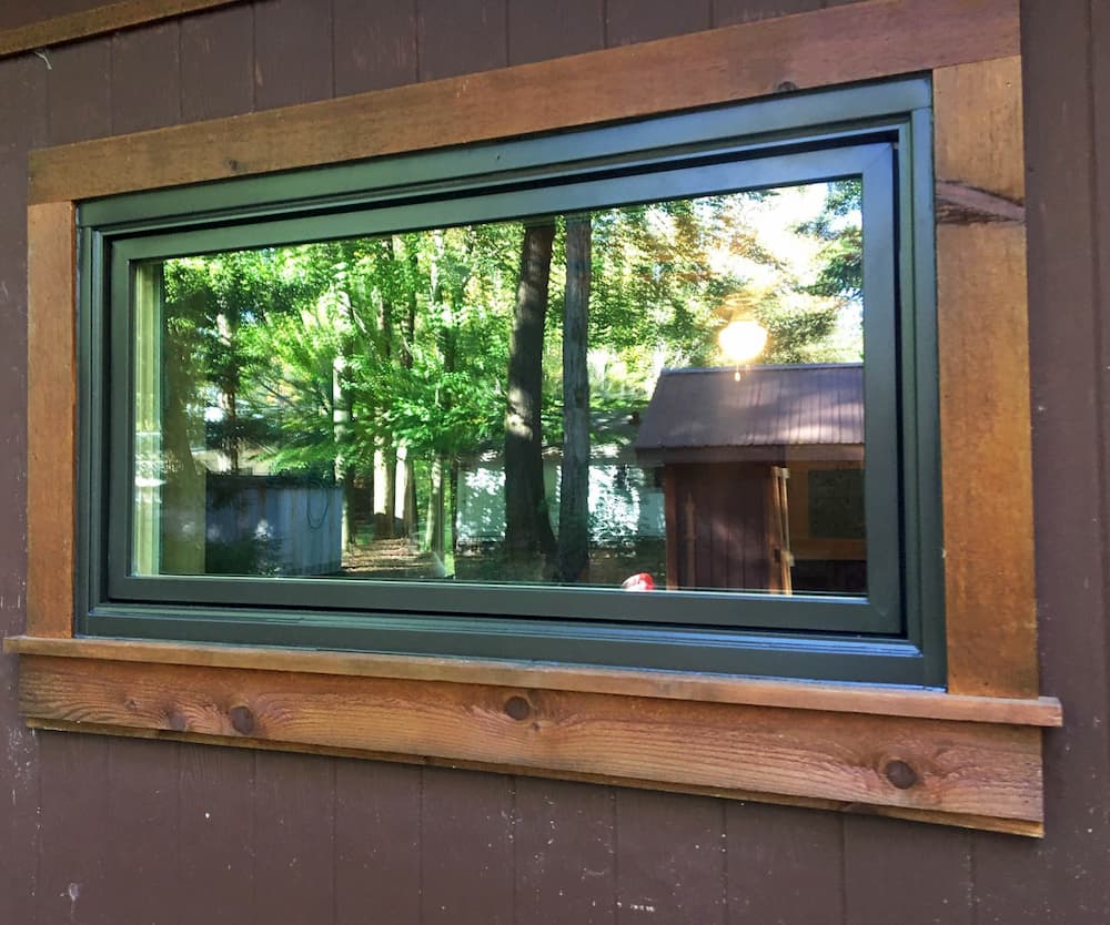 Exterior view of wood awning window with green cladding
