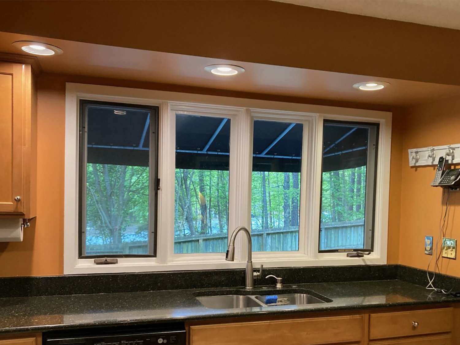 Four casement windows sit above the sink in Henrico kitchen