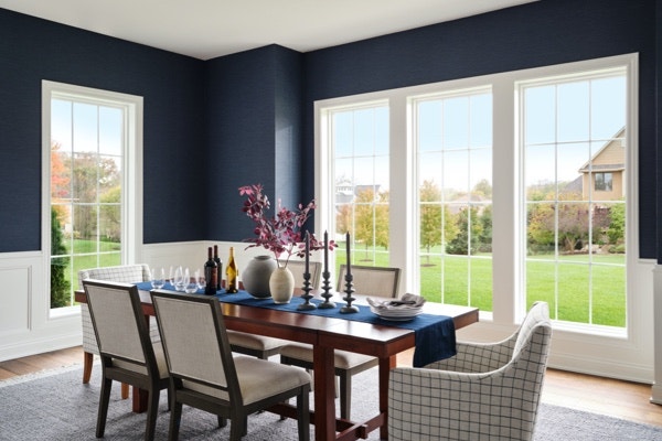 a dining area featuring painted window trim