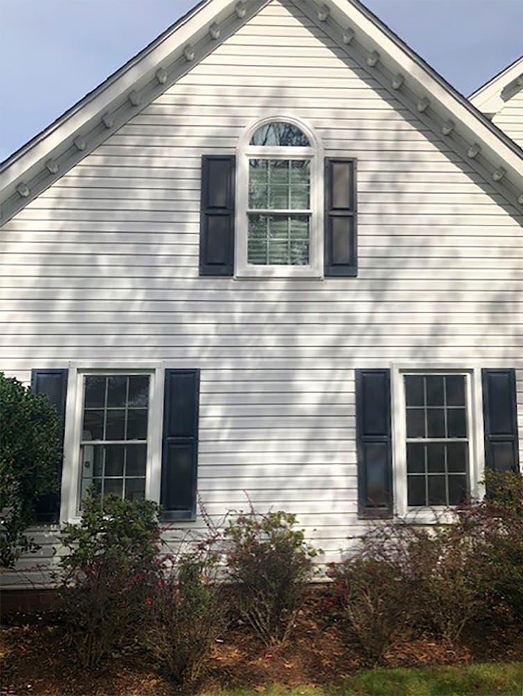 Exterior of two-story Virginia Beach home featuring new vinyl double-hung windows