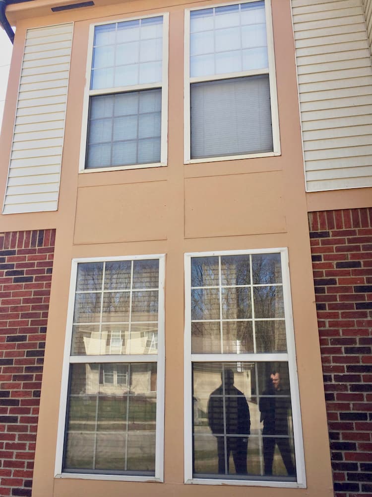 Exterior view of 4 old double-hung windows