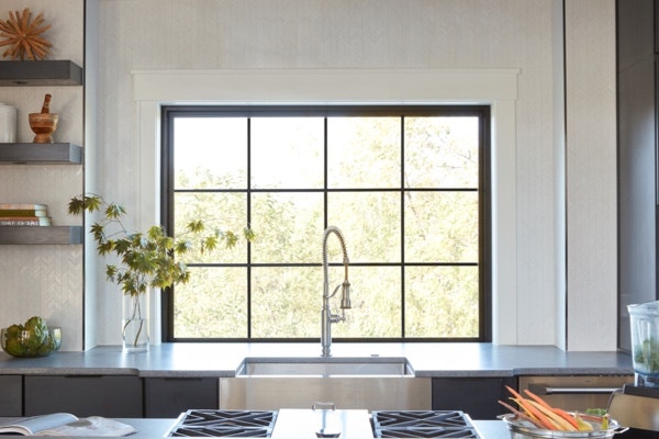 farmhouse kitchen featuring a Pella window with thin grilles to create a prairie window design