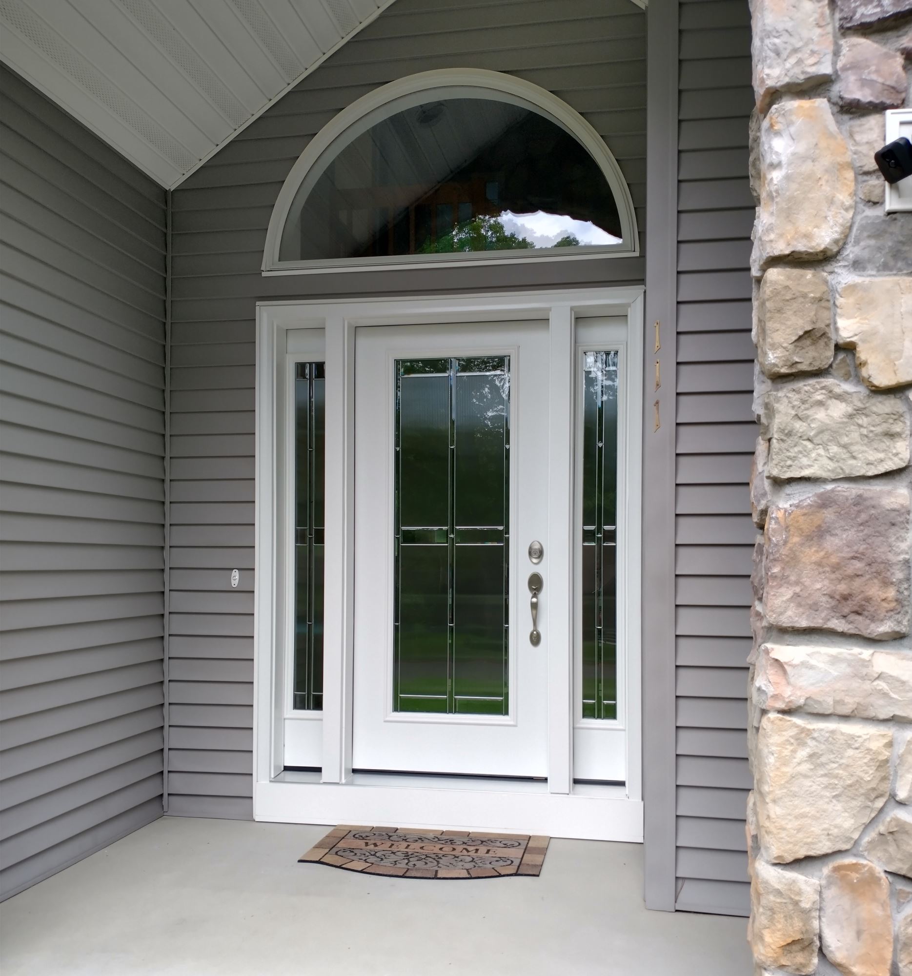 After exterior shot of Pella replacement entry door for Ludlow home