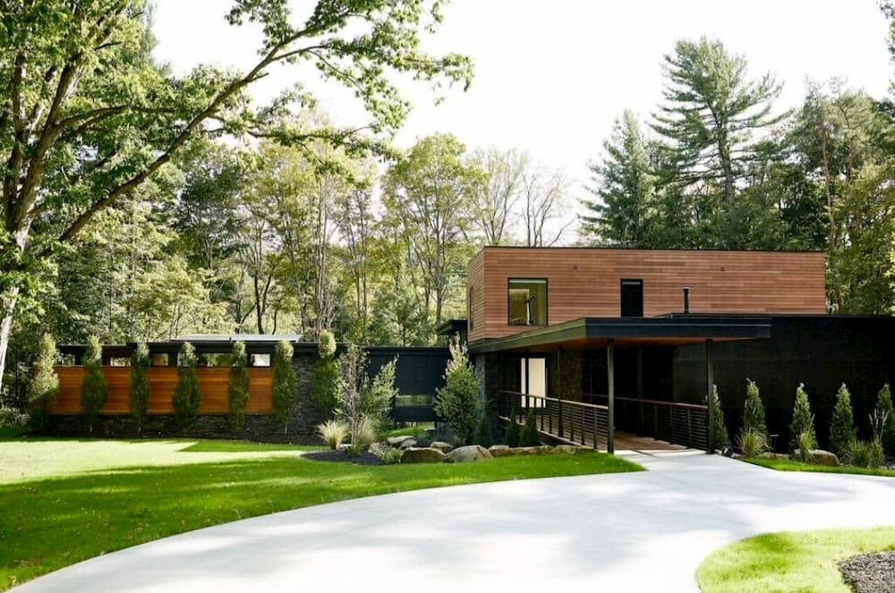 Front exterior of modern home with contemporary black windows