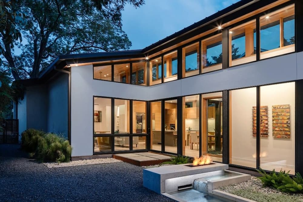 Contemporary Austin home with new aluminum-clad wood windows photographed in evening 
