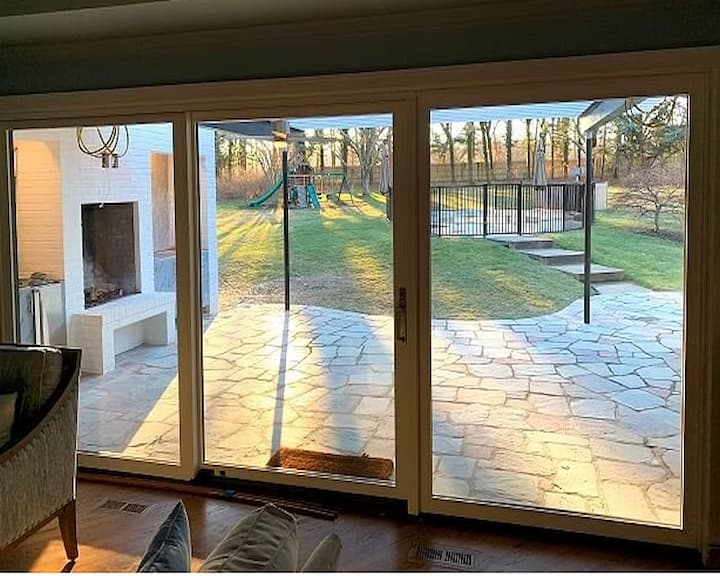 Interior view of triple-panel sliding glass patio doors with unobstructed glass space