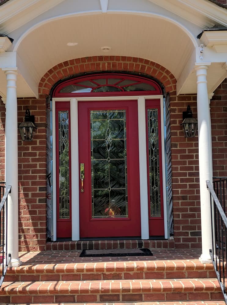 New red entry door with art glass and sidelights