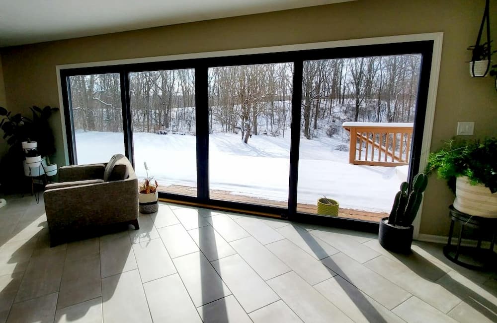 Living room with black wood multi-slide patio doors