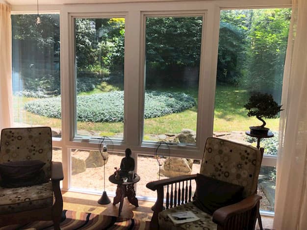 Interior view of four seasons porch with fiberglass casement windows