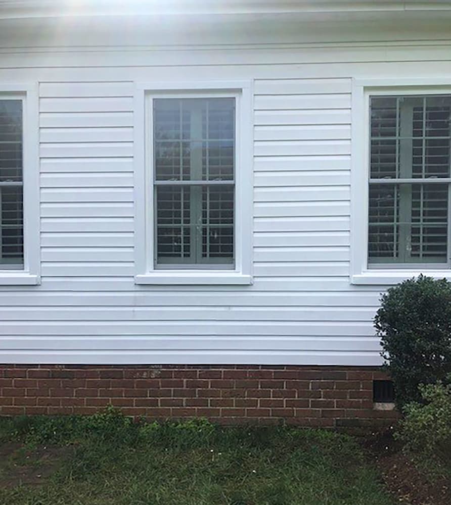 Close-up shot of new vinyl replacement windows on Virginia Beach home