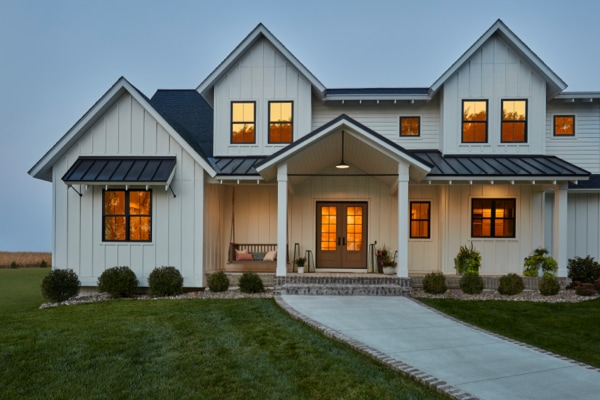 Light Gray Home Featuring Pella Windows With Black Trim And Grilles