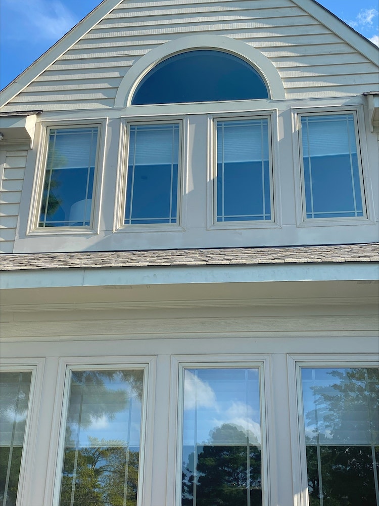 Exterior of first- and second-story windows on Virginia Beach home