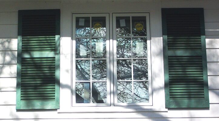 upper window image of allenstown home with new wood casement windows