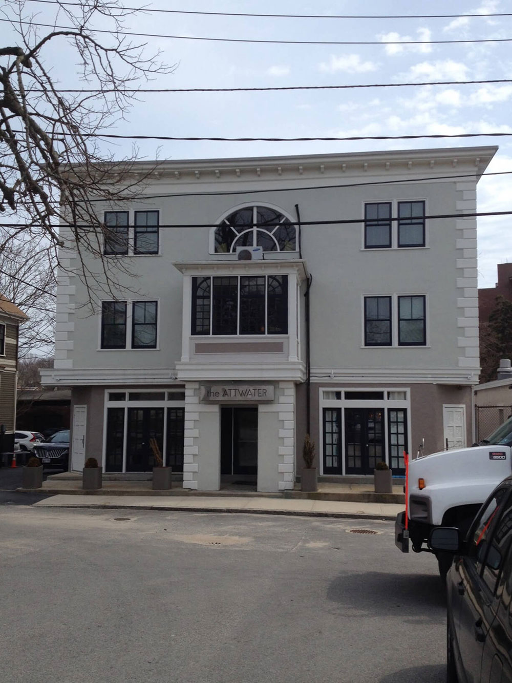 Black double-hung windows on the front of The Attwater in Newport, RI