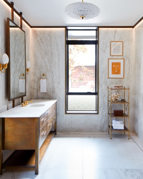 bathroom with marble walls and beautiful natural light