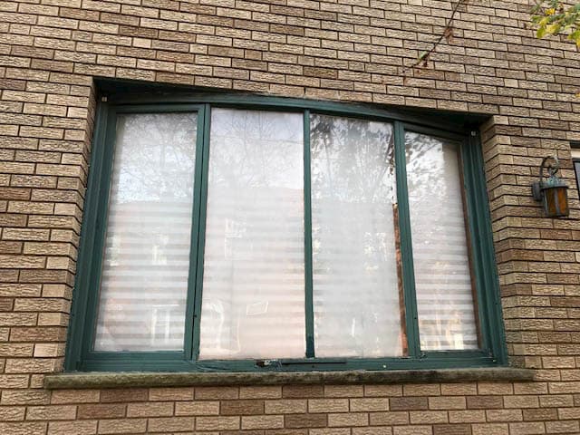 Old, damaged bow window