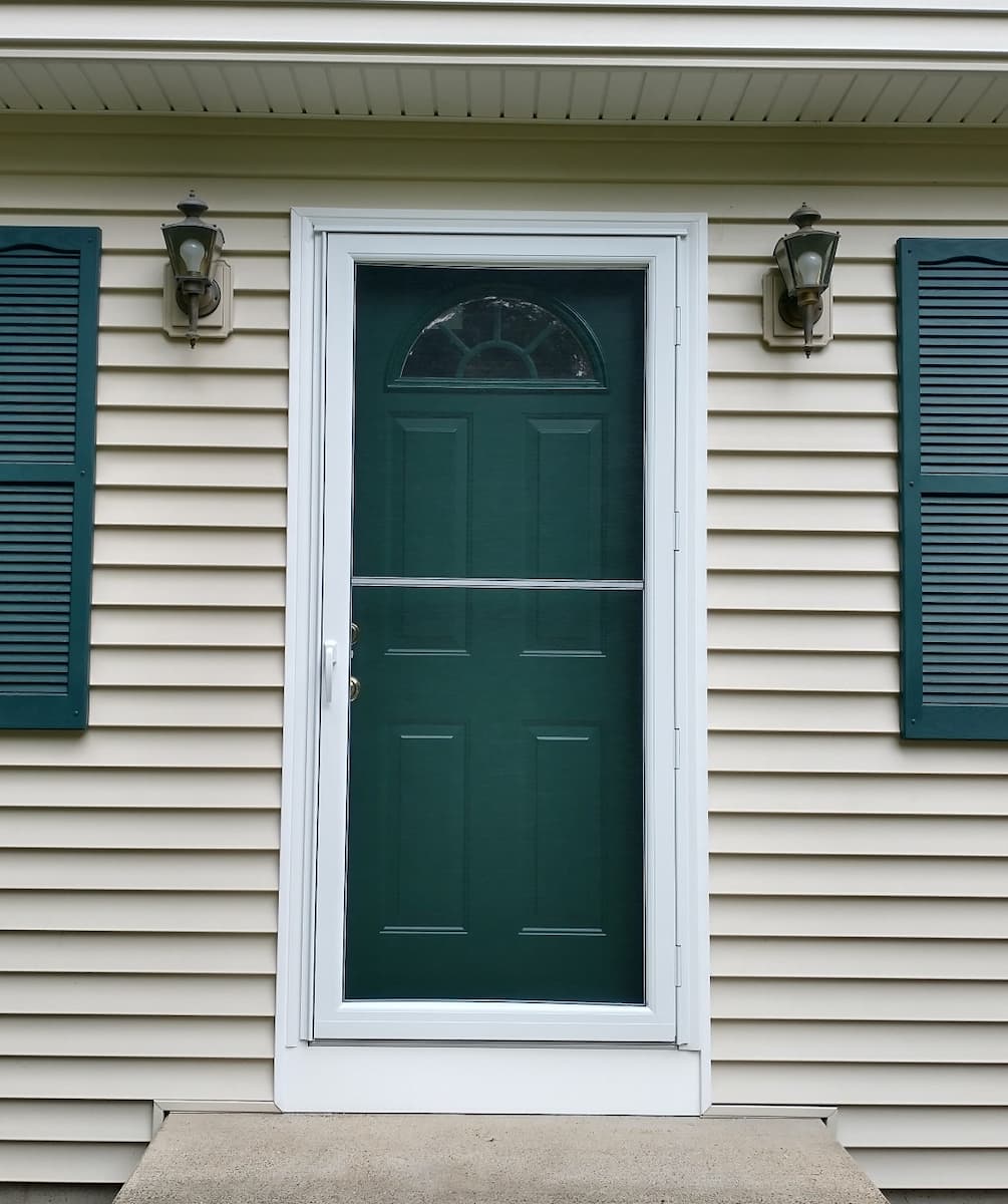 Exterior view of new steel green entry door