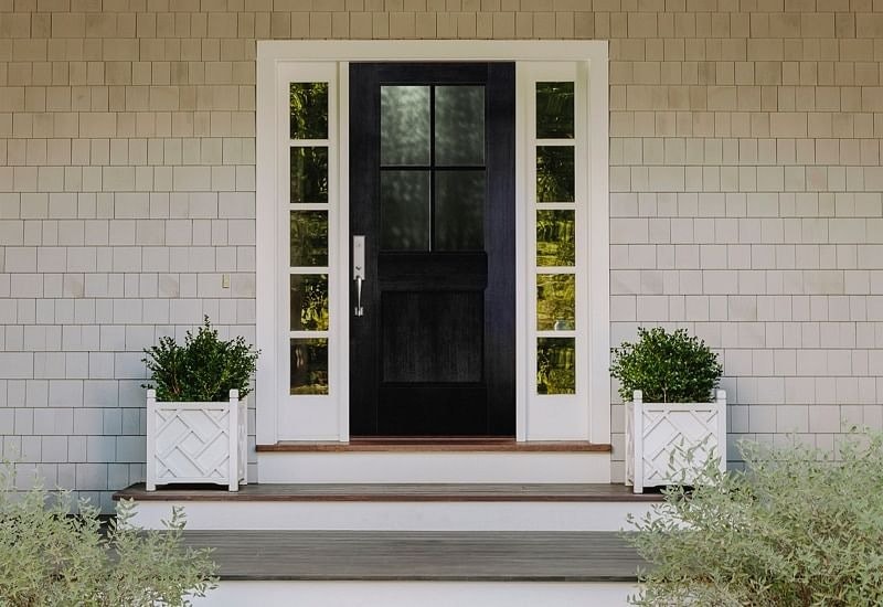 Black front door with white sideligh
