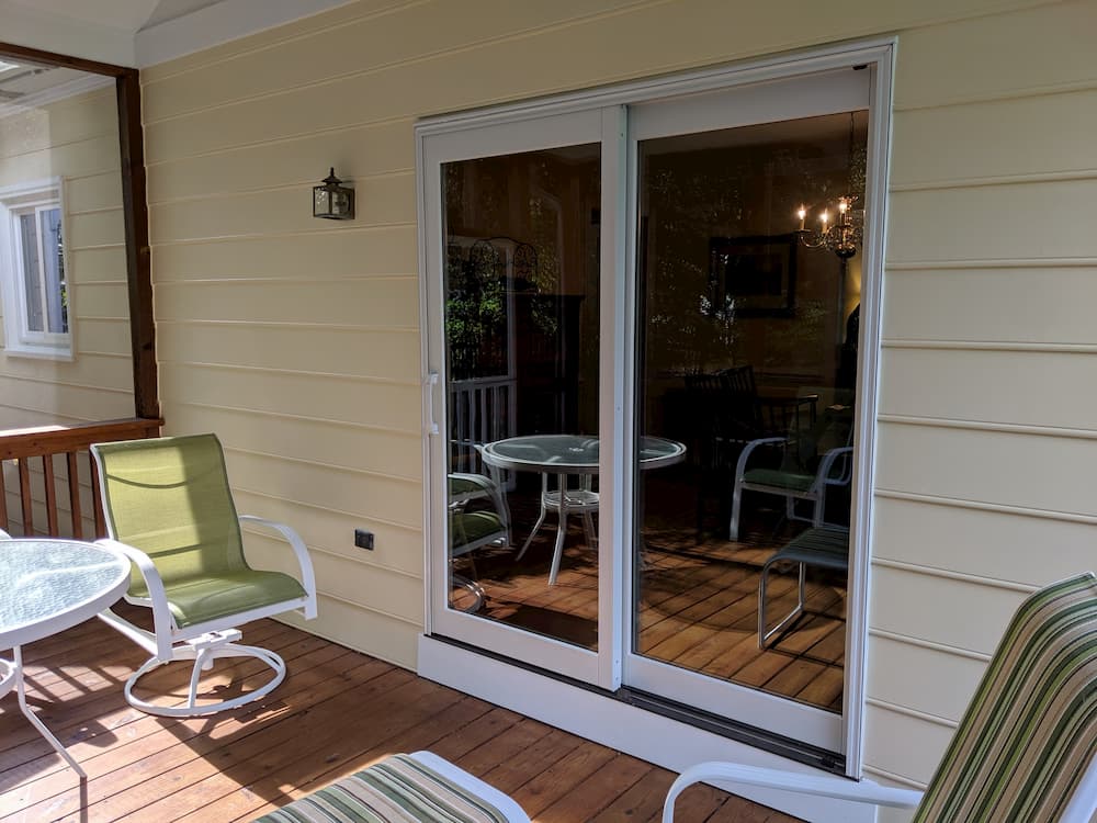 Exterior view of porch with new wood sliding patio doors