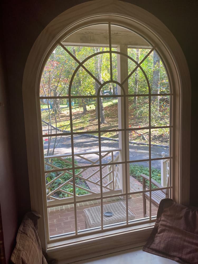 Interior shot of new special shape wood windows in Henrico home, unfinished for customization