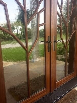 Wood glass door with brown hardware