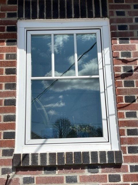Close up of white wood casement window