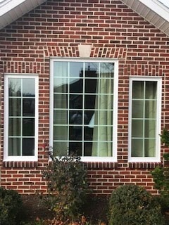 new picture window on classic brick home