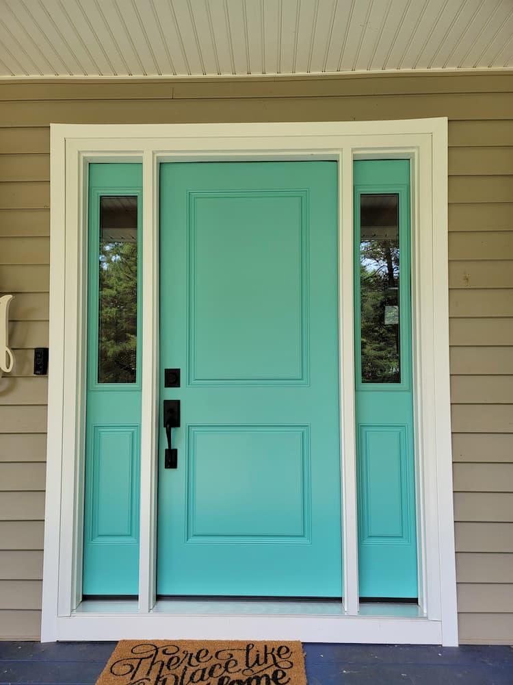 Blue fiberglass front door with sidelights on Powhatan home