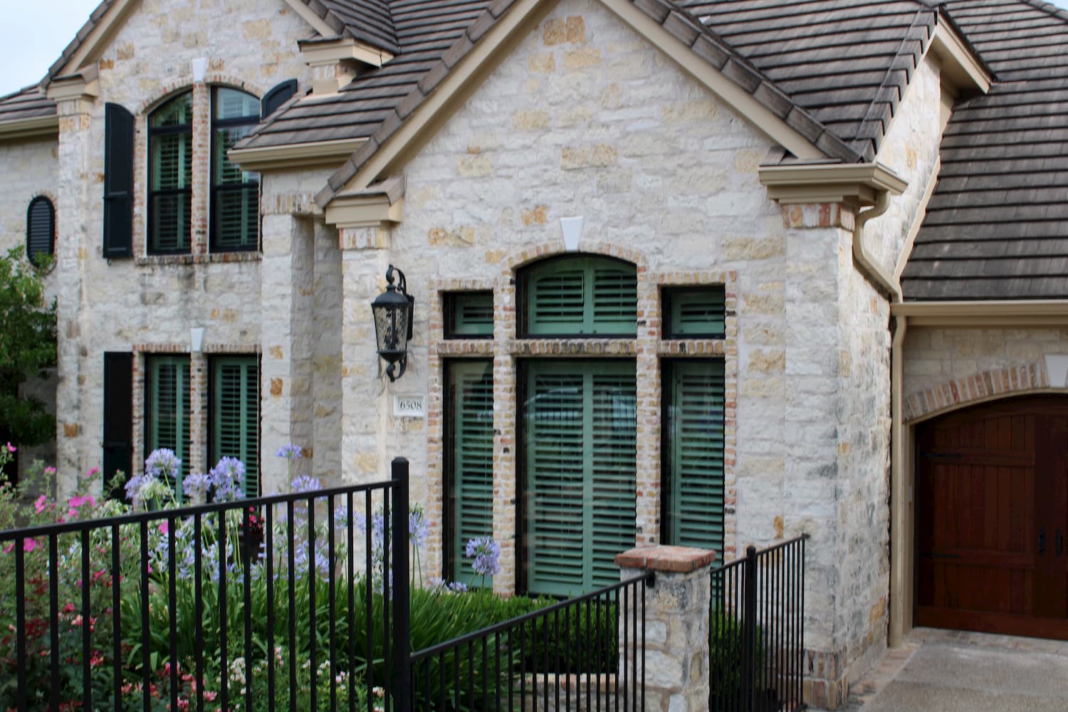Multiple replacement Pella windows on front exterior of Austin home