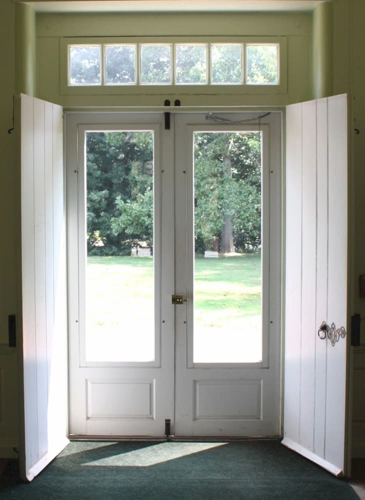 Interior view of old French doors and transom window