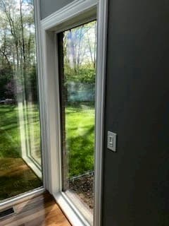 New fiberglass picture window from Pella replaces side entry door