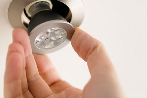 Hand adjusting energy-efficient LED light fixture