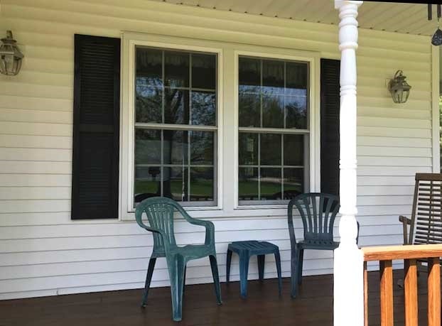 vinyl double-hung window replacement on porch