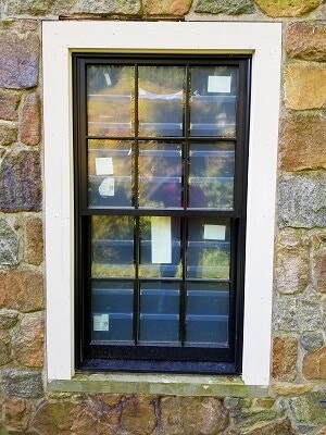 window view of 80 year old home with new wood double hung windows