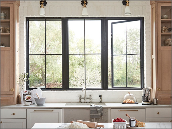 A kitchen with a large window