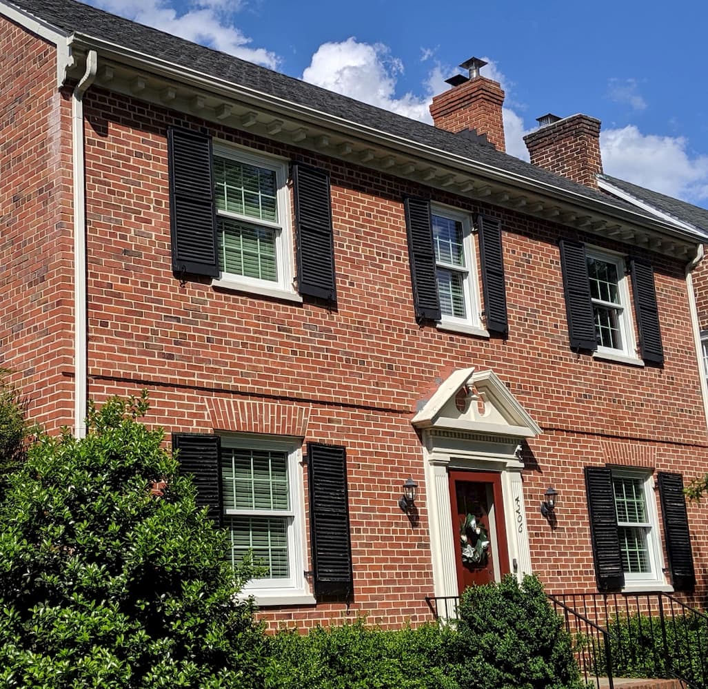 Red brick homes in Richmond with all new wood double-hung windows with traditional grille patterns