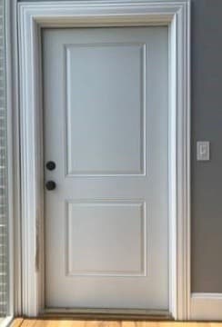Interior view of white side entry door prior to replacement