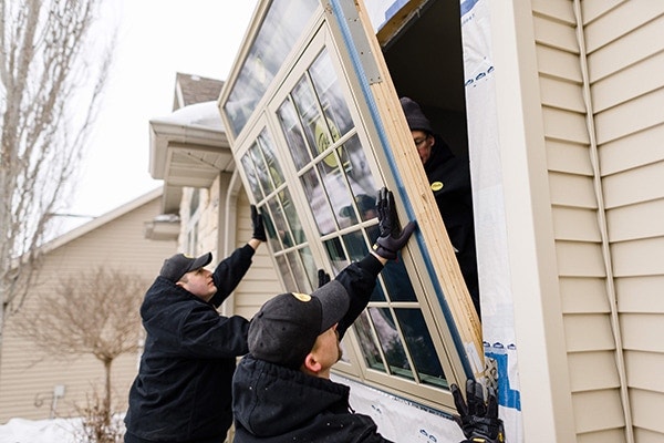Pella installation team putting in new double window
