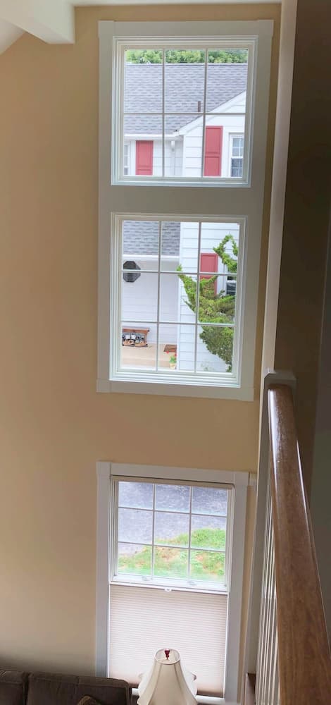 Interior view of a series of fixed wood windows