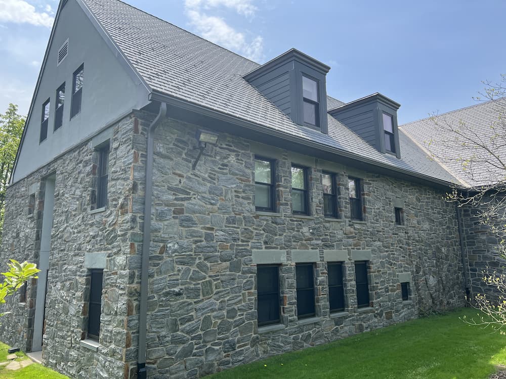 Side view of historic dorm buildings with new black windows