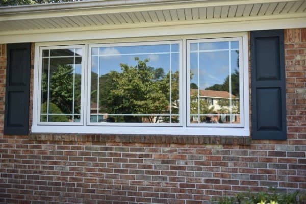 New fiberglass casement windows on red brick home