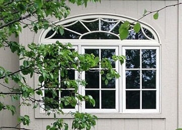 three windows home exterior tree branch