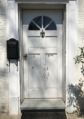 before image of royersford home with new black fiberglass entry door