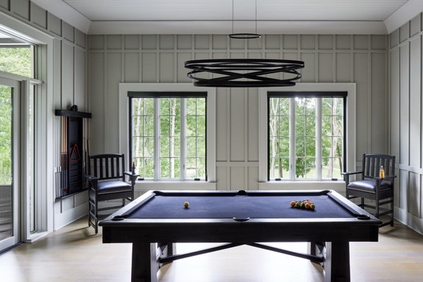 a game room in a home featuring unique interior window trim