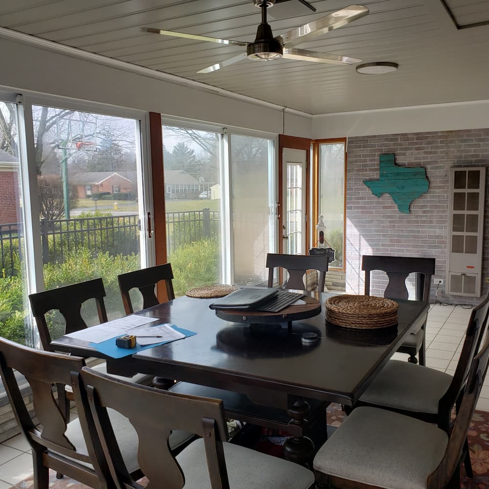 Interior view of table surrounded by new Pella vinyl windows